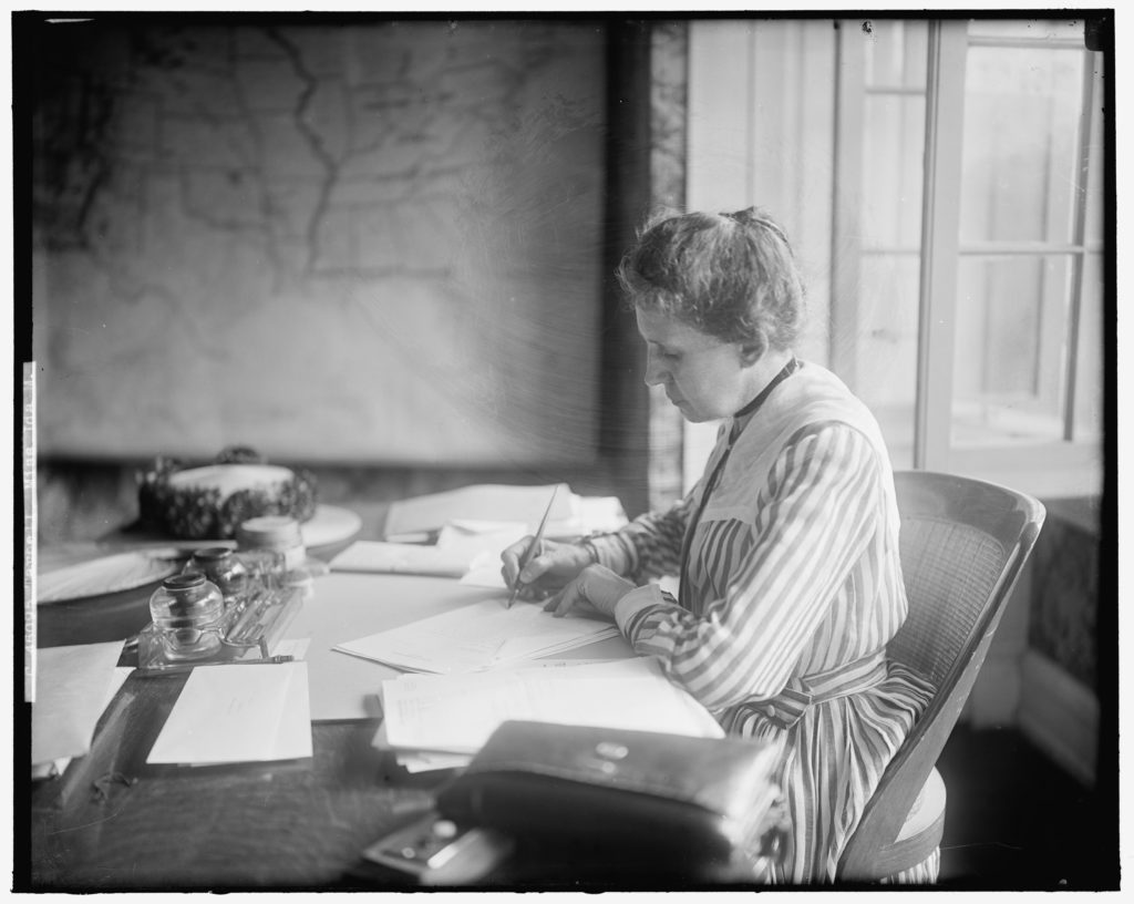 Ida Tarbell at desk